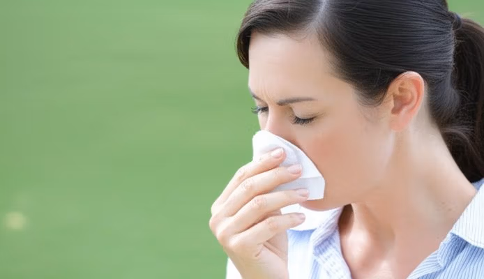 Woman wiping nose