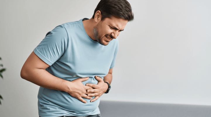 Man with stomach discomfort